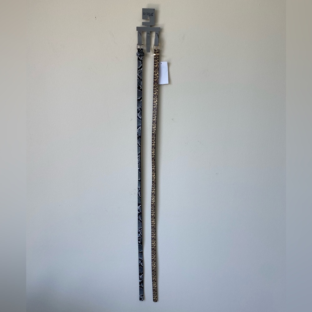 Two woman’s fashion belts